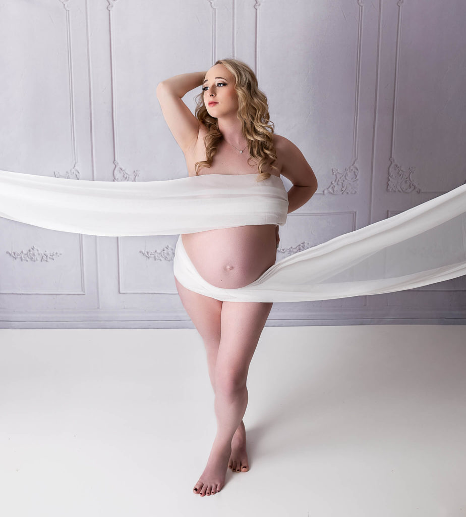 beautiful maternity photography session with white drape