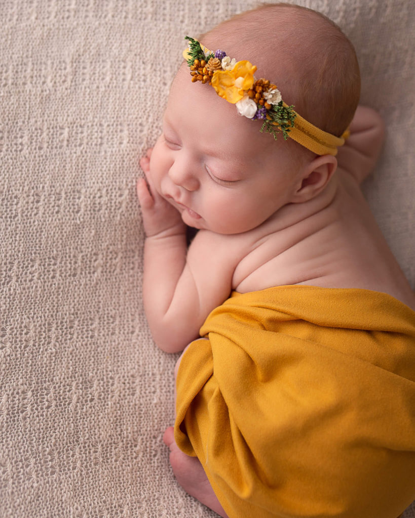 Newborn posed image of Cleveland newborn photographer studio.
