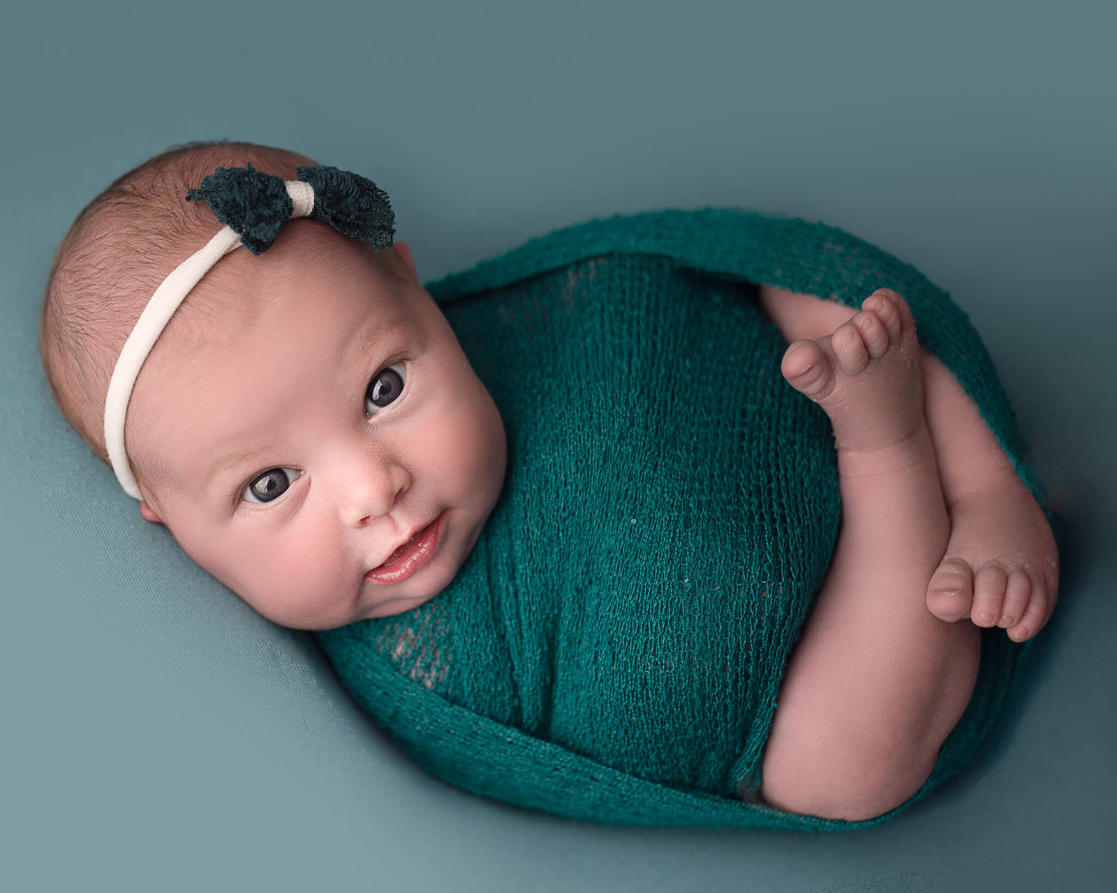 Akron OH newborn photographer captures happy newborn