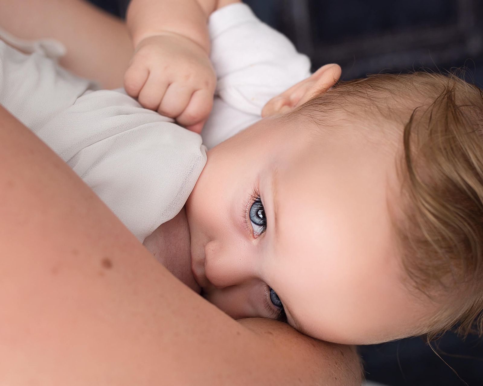 close up of breastfeeding child during breastfeeding photoshoot in Akron ,OH