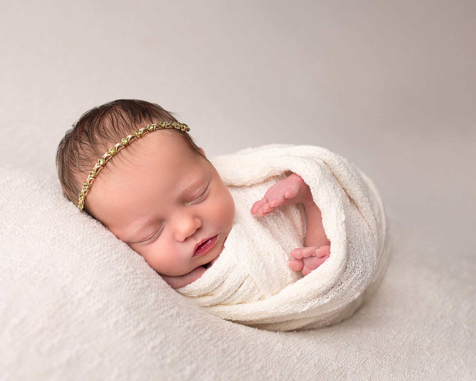 sleeping newborn during newborn photography session. Let's discuss newborn care tips!