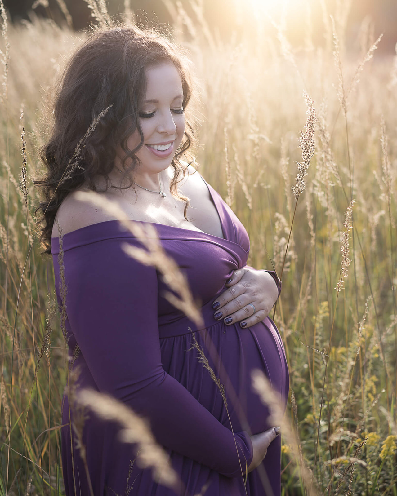 prenatal massage in akron oh in blog photo of pregnant woman in blue dress