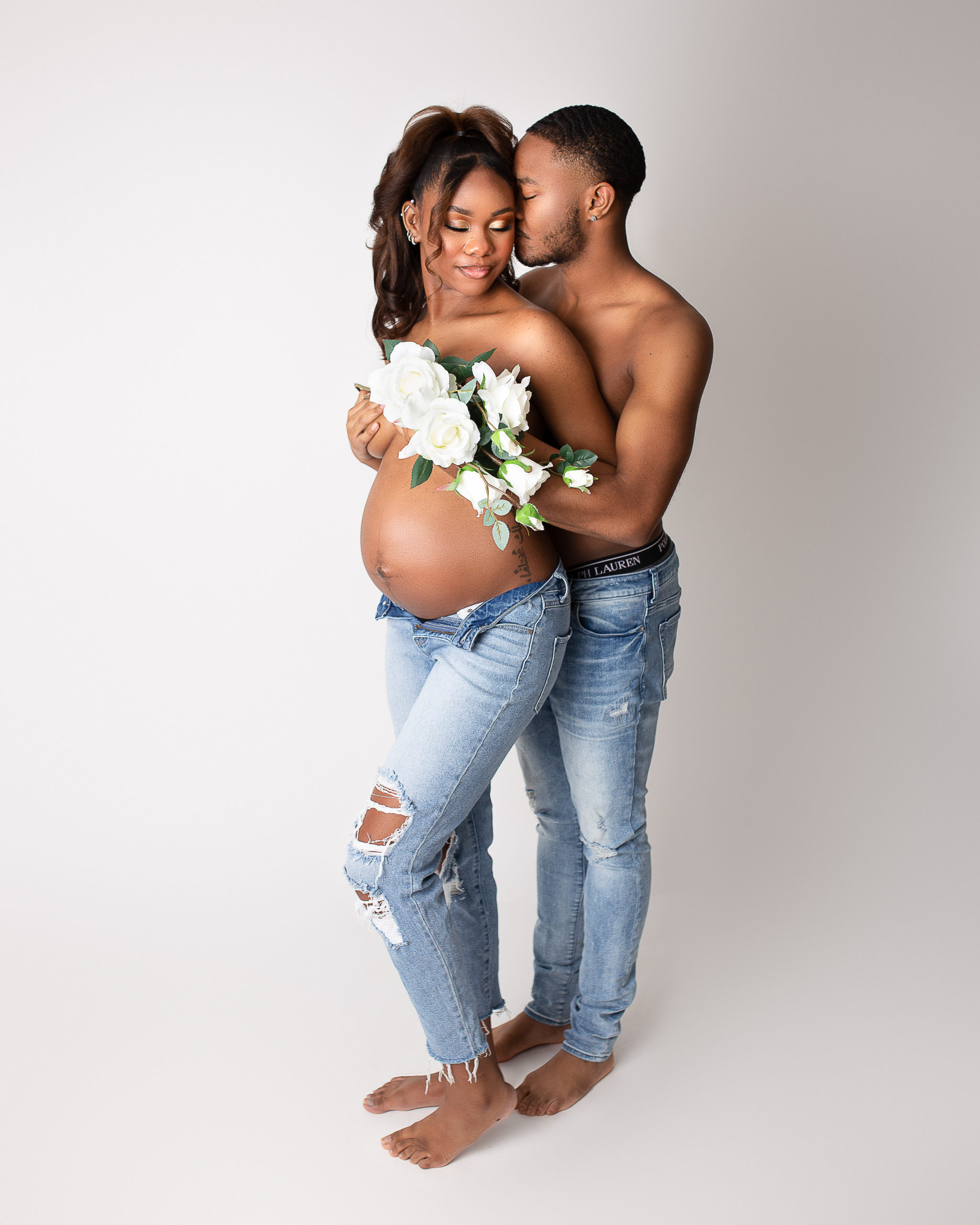 places to shop for a baby shower in Akron in blog photo of pregnant mom and dad during couples maternity shoot