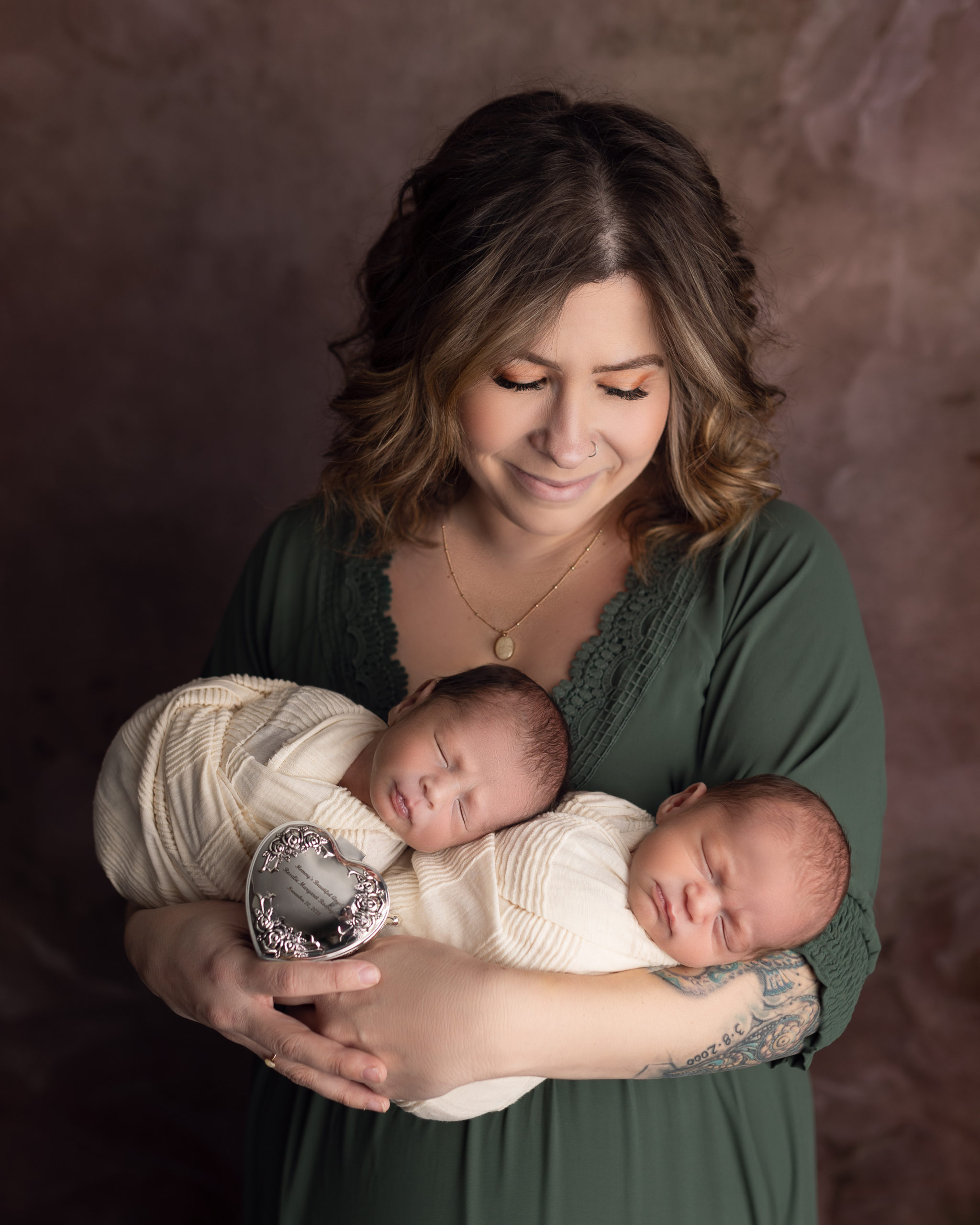 signs of post partum depression in blog photo of mom holding newborn twins