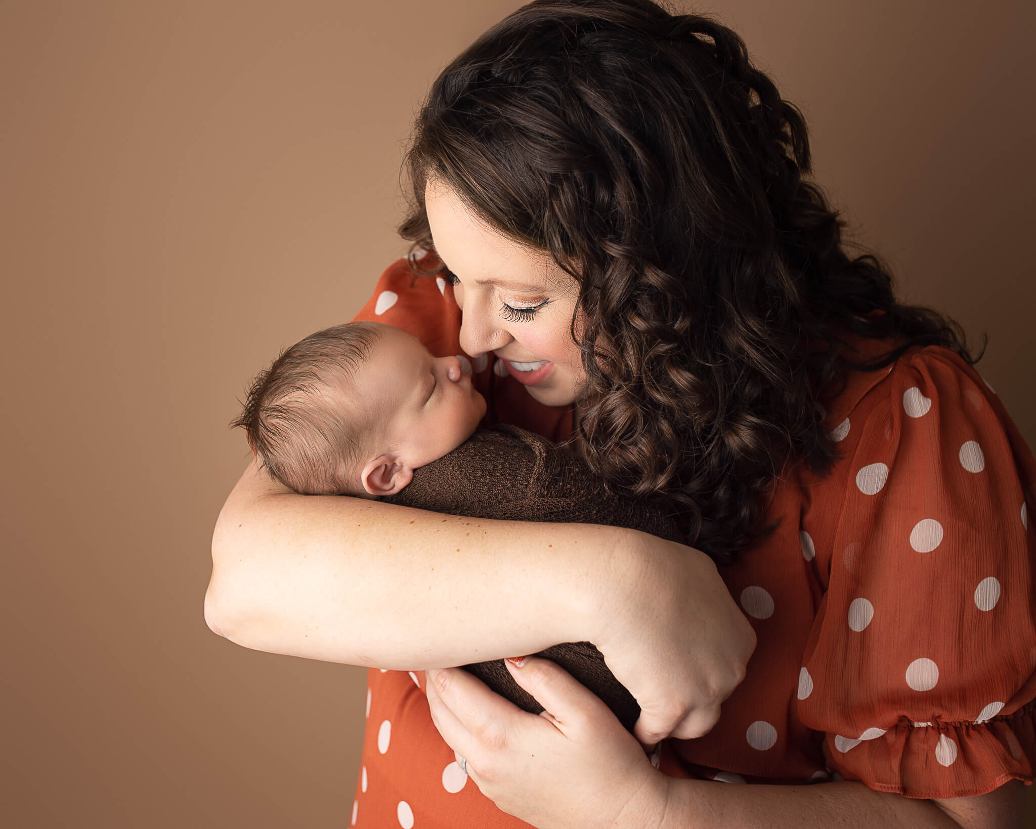 signs of post partum depression in blog photo of mom holding newborn