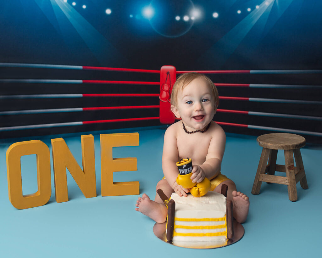 indoor playground in Cleveland, boxing themed milestone cake smash photography session 