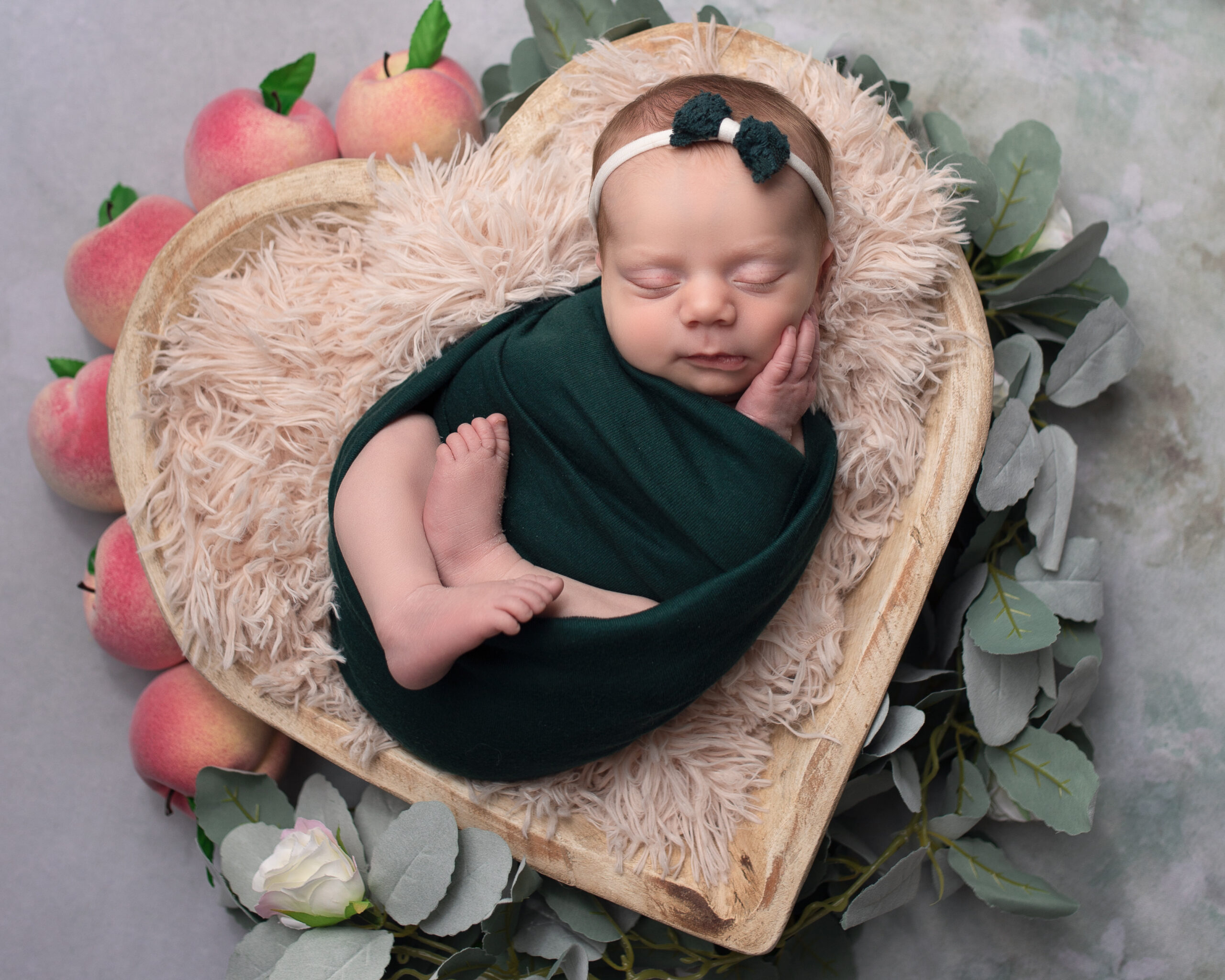baby stores in Cleveland, newborn photography baby in heart basked