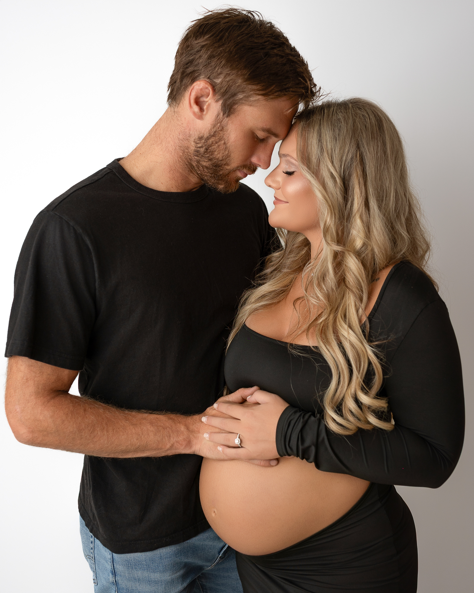 Canton Ohio maternity photographer capturing expecting couple in studio maternity session.