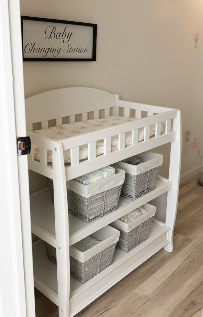 Baby changing area inside professional newborn photography studio in Canton Ohio